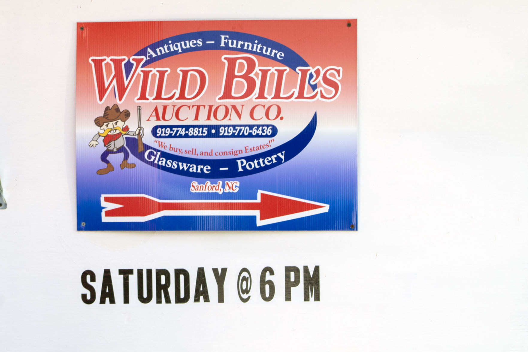 Sign in front of Wild Bill's auction house.